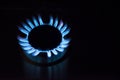 Blue fire in gas burner. Gas burning from a kitchen gas stove Royalty Free Stock Photo