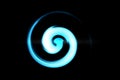 Blue fire with luminous swirling on black backdrop. Glowing spiral with light circles light effect, abstract background Royalty Free Stock Photo