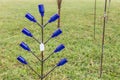 Dark Blue Bottle Tree Lawn Art Royalty Free Stock Photo