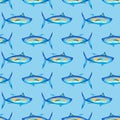 Blue fish on a light blue background. Seamless pattern. Watercolor illustration with cute tuna. For fabric, wallpaper, wrapping