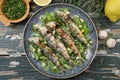 Blue fish roasted pilchard on green table background Royalty Free Stock Photo