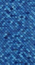 Blue fish scale pattern with a textured surface, resembling overlapping semicircular Royalty Free Stock Photo