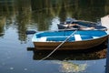 Blue fishing boat in a calm river water Royalty Free Stock Photo