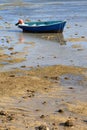 Blue Fishing Boat At Low Tide