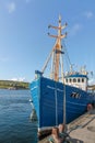 Blue fishing boat in the port