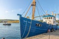 Blue fishing boat in the port