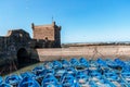 Blue Fishing boats and defensive tower in Essaouira - Morocco