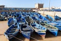 Blue fishing boats in harbour moorings