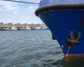 Blue fishing boats lie in scheveningen harbor