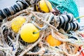 Blue fishing net on a pontoon with its ropes and floats covered with morning frost Royalty Free Stock Photo