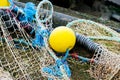 Blue fishing net on a pontoon with its ropes and floats covered with morning frost Royalty Free Stock Photo