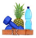 Blue fitness dumbbells, pineapple, belt and PET bottle with water