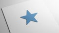 A blue five pointed star is centrally placed on a white square sheet of Royalty Free Stock Photo