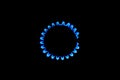 The blue flame of a cooker burner