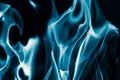 Blue flame fire on a black background Royalty Free Stock Photo