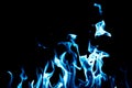 Blue flame fire on black background Royalty Free Stock Photo