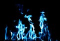 Blue flame fire on black background Royalty Free Stock Photo