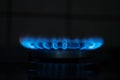 Blue flame gas in the dark. Burning gas, gas stove burner, hob in the kitchen Royalty Free Stock Photo