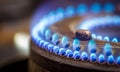 Blue flames on a domestic gas stove burner Royalty Free Stock Photo