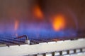 Blue flames of a gas burner inside of a boiler Royalty Free Stock Photo