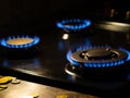 Blue flames on gas stove burner Royalty Free Stock Photo