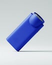 A blue flashlight lies on its side, angled towards the camera, against a plain white background. The flashlight has a rounded head Royalty Free Stock Photo