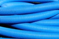 Blue flexible hose coiled.