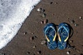 Blue flip-flop sandals on the beach