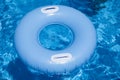 Blue floater with handles in water of pool Royalty Free Stock Photo