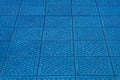 Blue floor tile stone ceramic abstract mosaic pattern surface street road city texture background backdrop navy Royalty Free Stock Photo