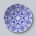 Blue floral pattern on a dish. Pastiche of Chinese porcelain painting.