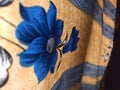 Blue flower in curtain with partial blur