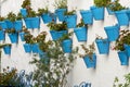 Blue flower pots on a white wall. Mijas. Royalty Free Stock Photo