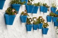 Blue flower pots on a white wall. Mijas Andalusia, Spain. Royalty Free Stock Photo