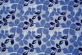 Blue flowers on textil background Royalty Free Stock Photo