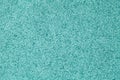 Blue fluffy background of soft, fleecy cloth. Texture of turquoise wool textile