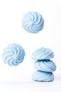 Blue flying marshmallows isolated in white background Royalty Free Stock Photo