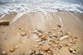 Blue foam waves on sea beach Royalty Free Stock Photo