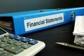 Blue folder with Financial Statements Royalty Free Stock Photo