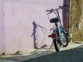 Blue folding bike parked on the street