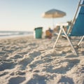 Tranquil beach scene with blue folding chair and soft sunlit sand Royalty Free Stock Photo