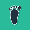 Blue Foot massage icon isolated on green background. Vector