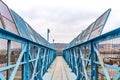 Blue footbridge over railroad