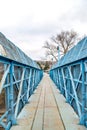 Blue footbridge over railroad