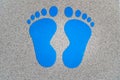 Blue footstep symbols painted on the floor to guide for the position. Decision making, choices concept, where to go Royalty Free Stock Photo