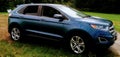 Blue Ford Edge with a scenic background!