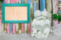 Blue frame and beautiful sculpture of boy and girl reading a book on colorful wooden background