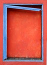 Blue frame on a boarded window