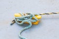 Blue Frayed Rope on Yellow Cleat Royalty Free Stock Photo