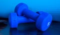 Blue free weights for excersie stacked on eachother